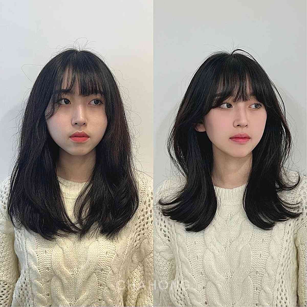 Bottleneck Bangs on Soft Wavy Layered Hair