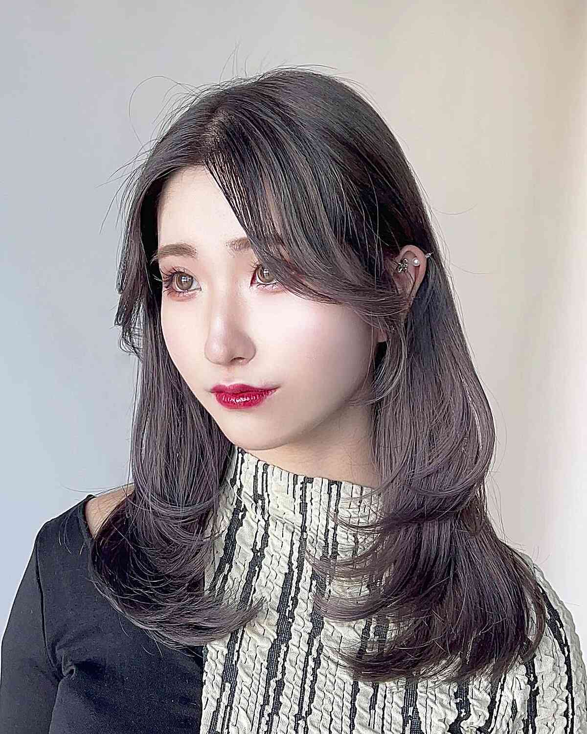 Center-Parted Style for Medium-Cut Layers and Fringe