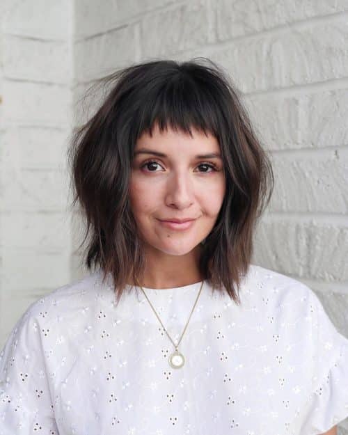 chic long bob with layers and short bangs