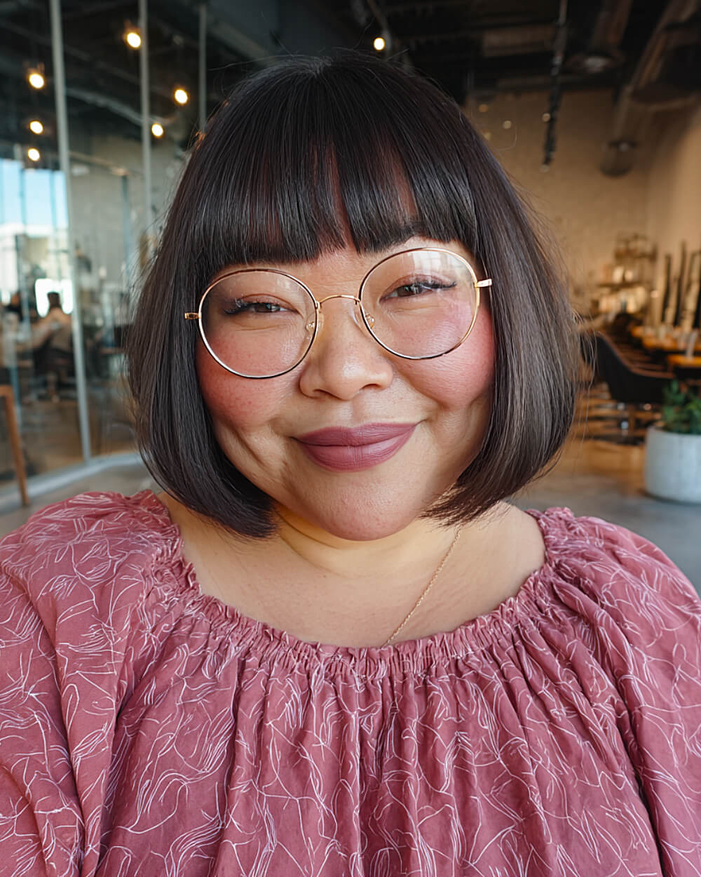 Chic rounded bob with bangs grazing the eyebrows