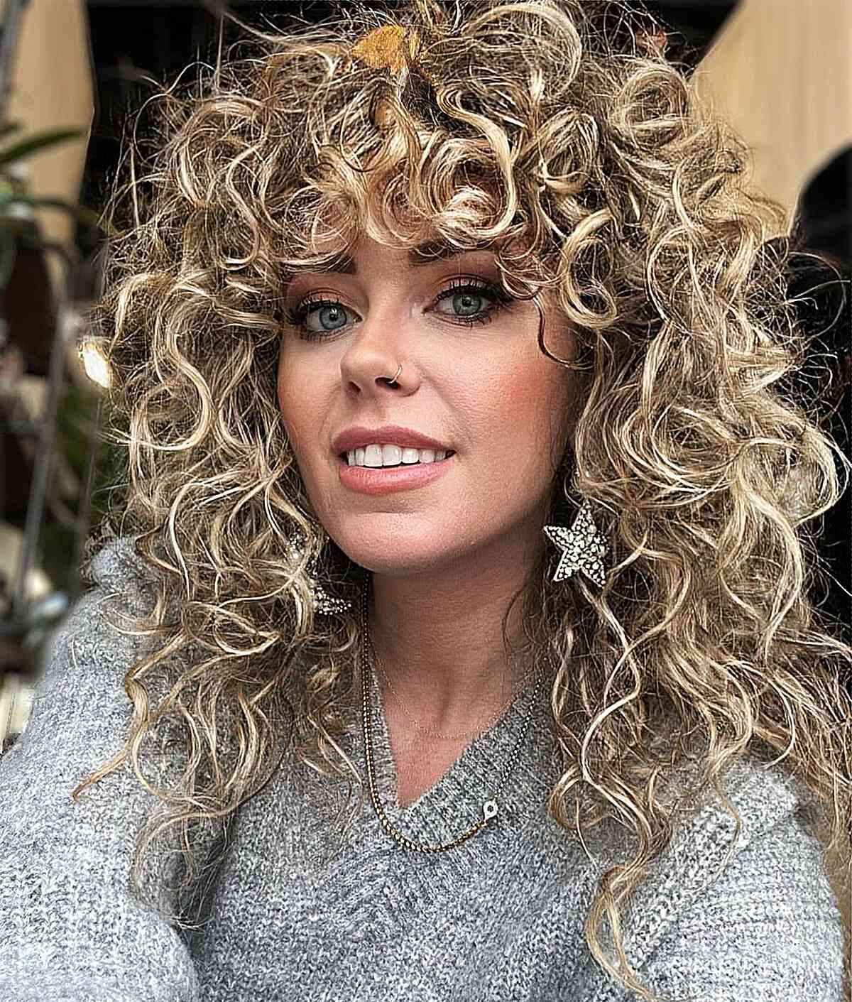 Curly Layered Haircut with Long Bangs