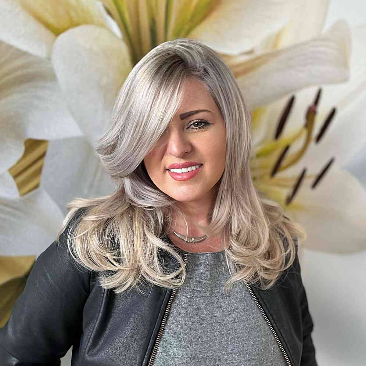 Deeply Side-Parted Layered Cut for Straight Hair on women with round faces
