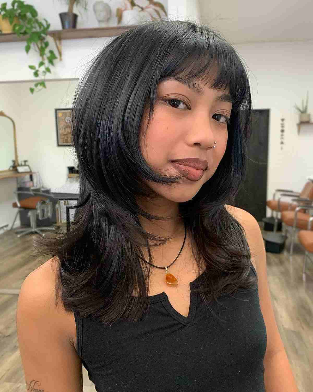 Feminine Face-Framing Short to Medium Layered Cut with Blunt Bangs