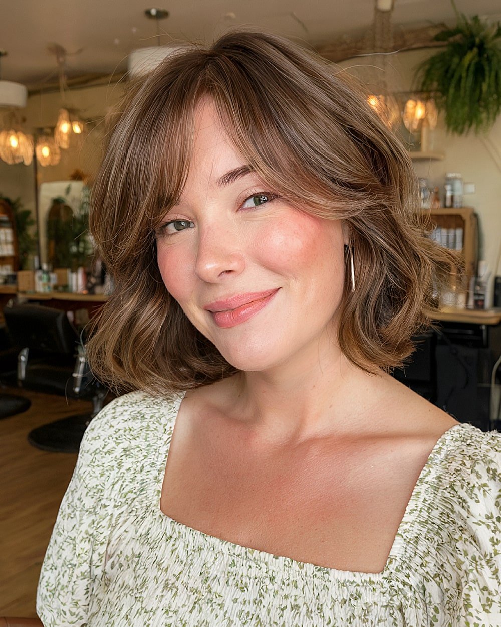 French bob with long side bangs on wavy brunette hair for a flattering, soft style