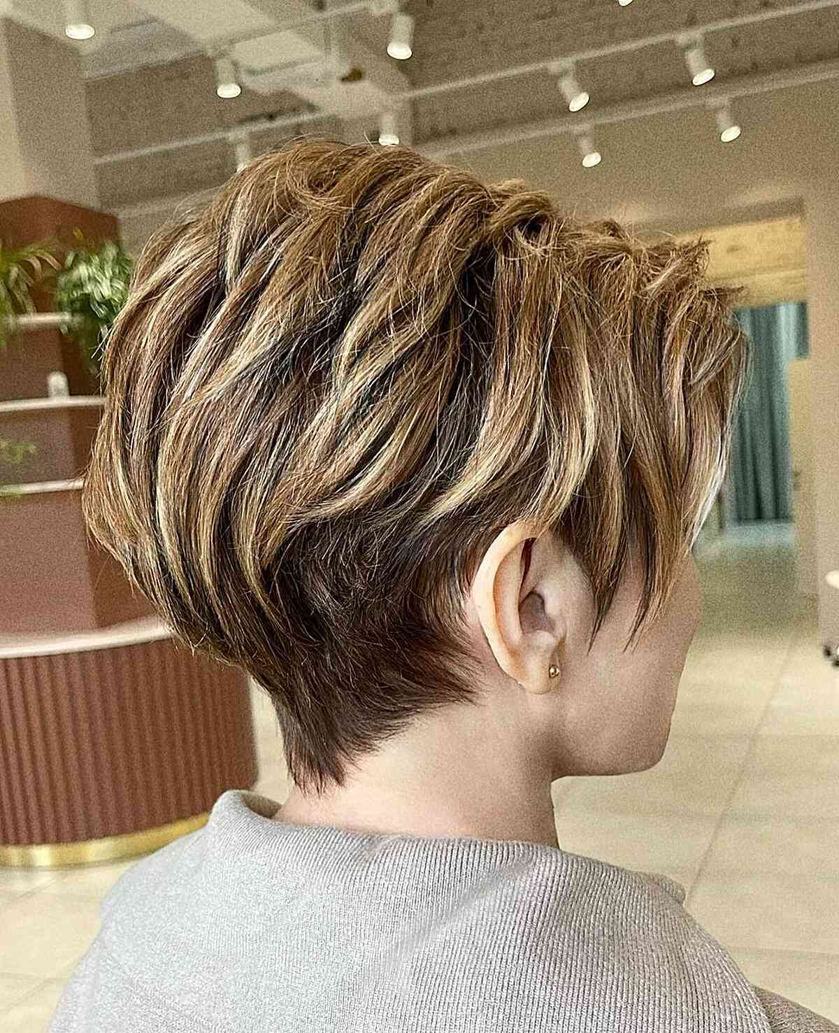Light Brown Highlights on a Long Pixie with Layers
