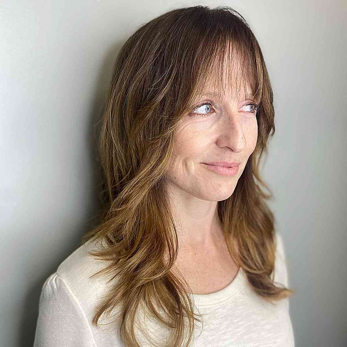 Light Brunette Layered Shag for women with long hair and wispy fringe