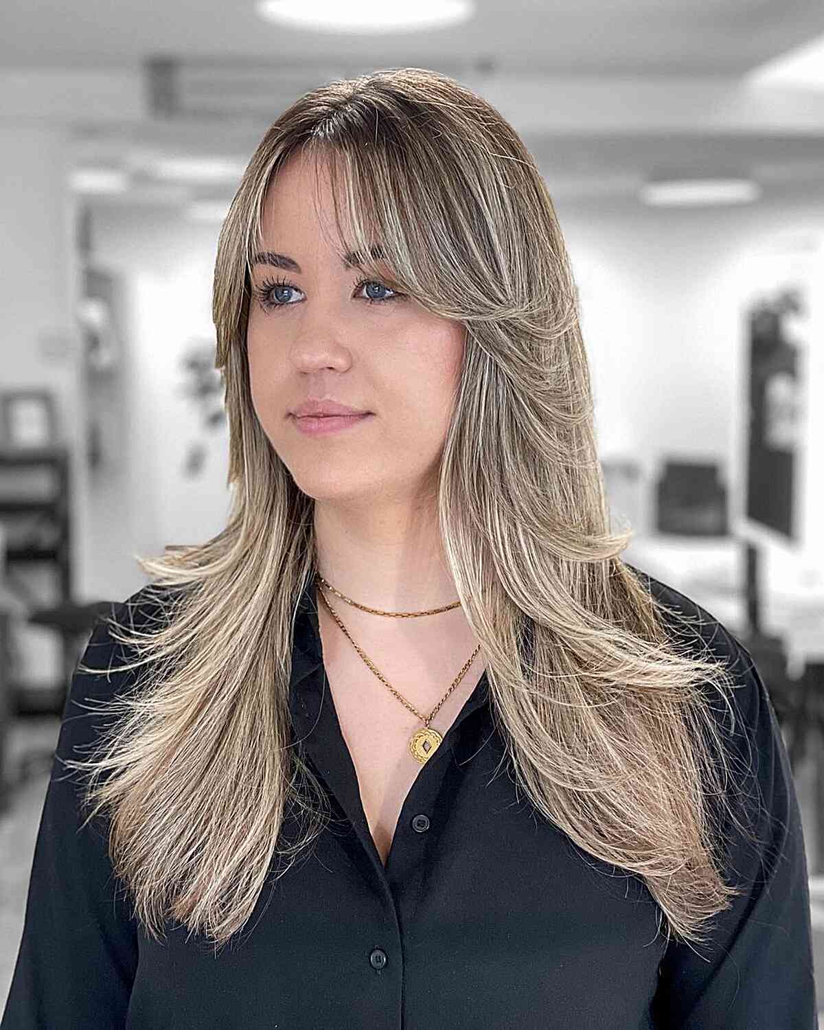 Long Butterfly Layered Cut with Curtain Bangs for Fuller Face Shapes