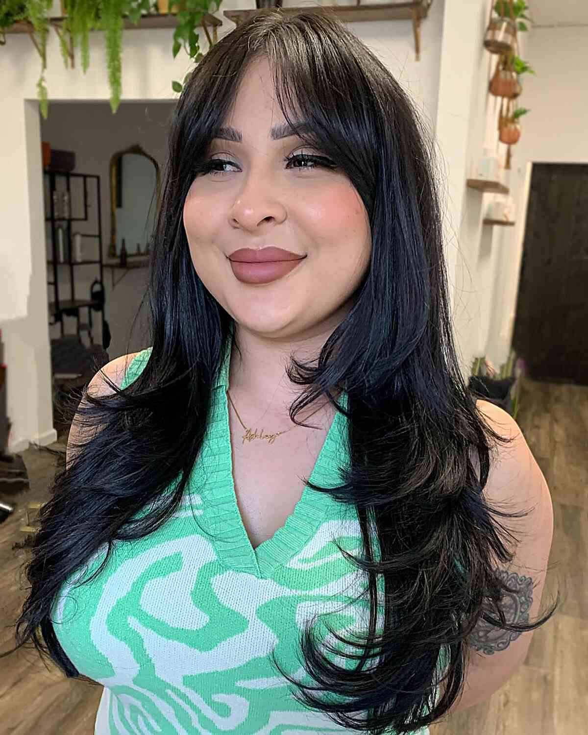 Long Layered Hair with Feathery Style and Bangs