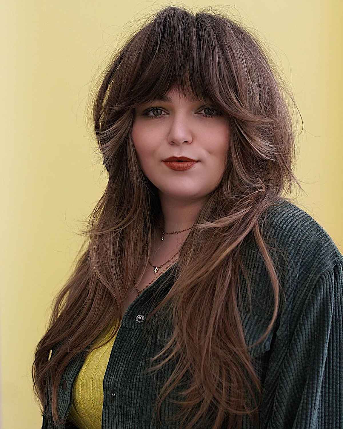 Long Layered Shag with Thick Bangs for Round Faces