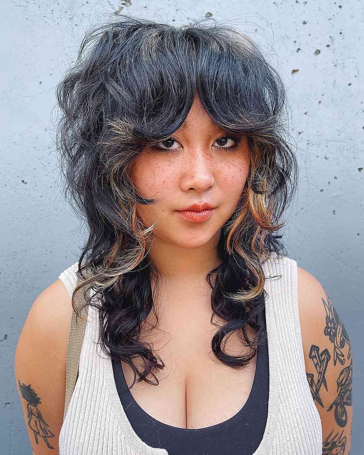 Long shaggy hair with middle part bangs