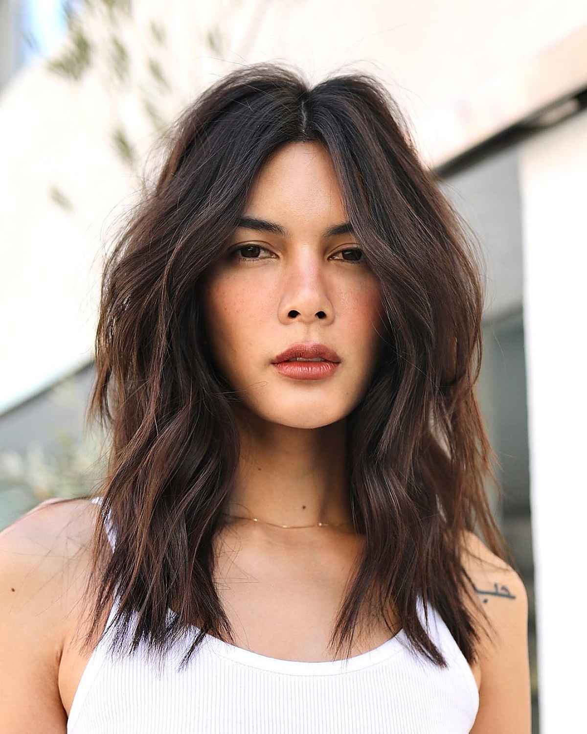 Mature middle-parted textured lob haircut