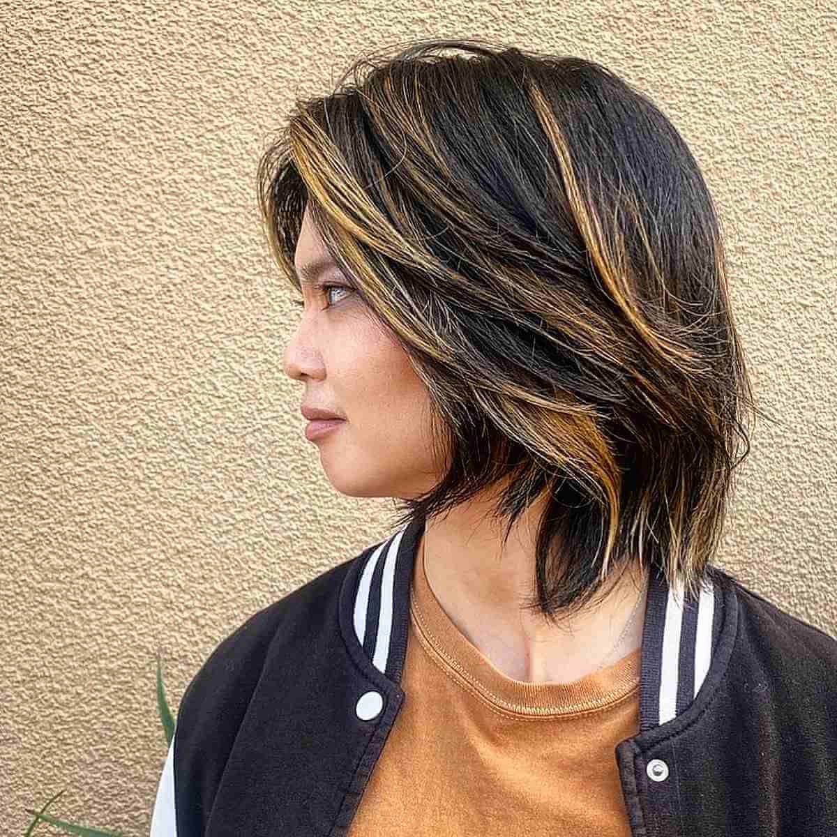 Mid-Length Shaggy Short Layered Bob with Warm Highlights