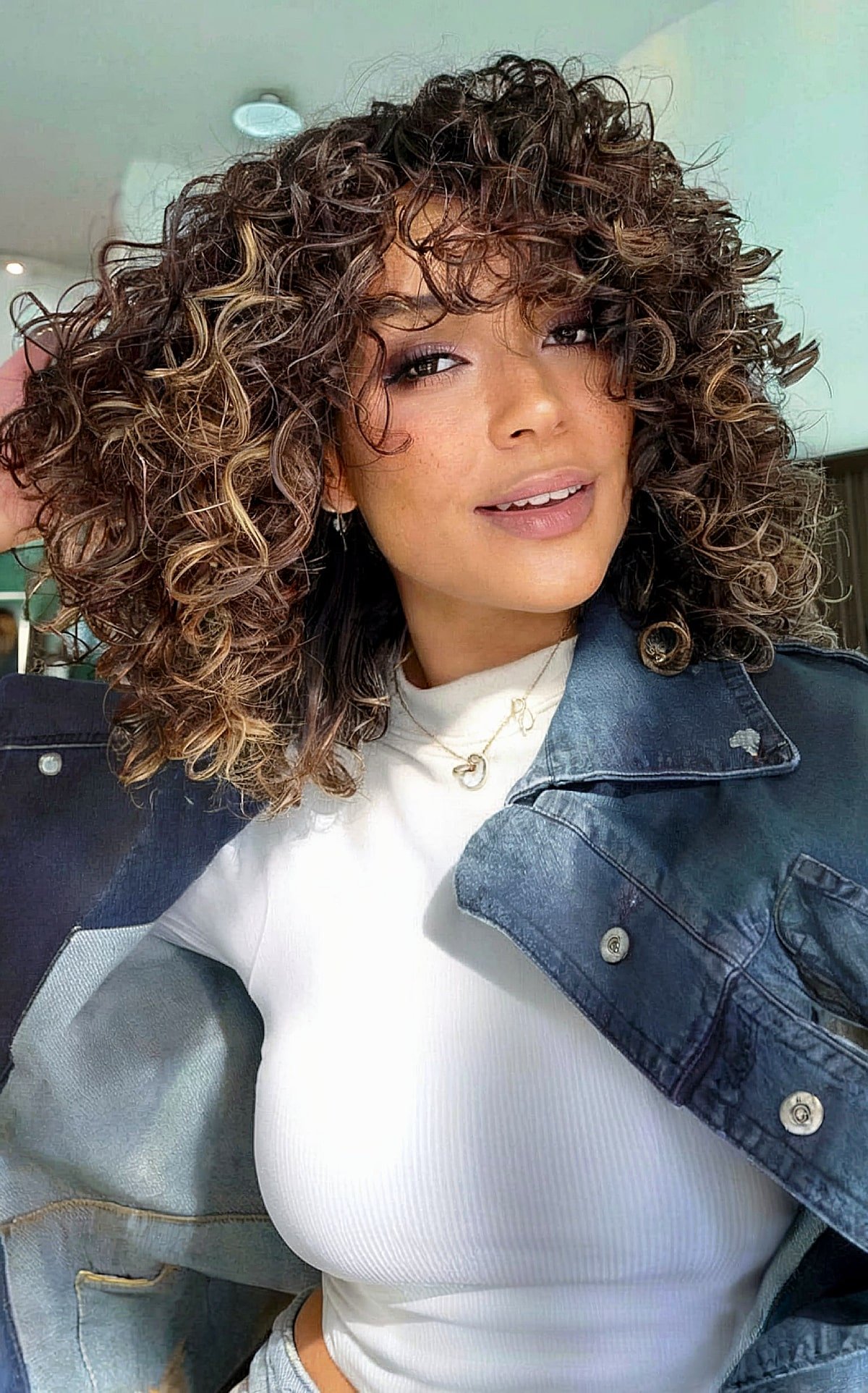 Naturally curly bob haircut with bangs