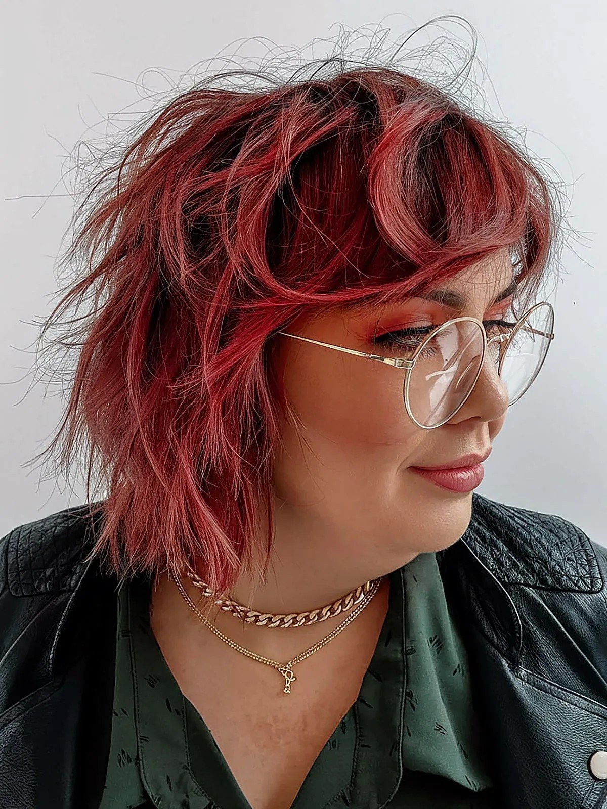 Shaggy short bob with bangs and glasses