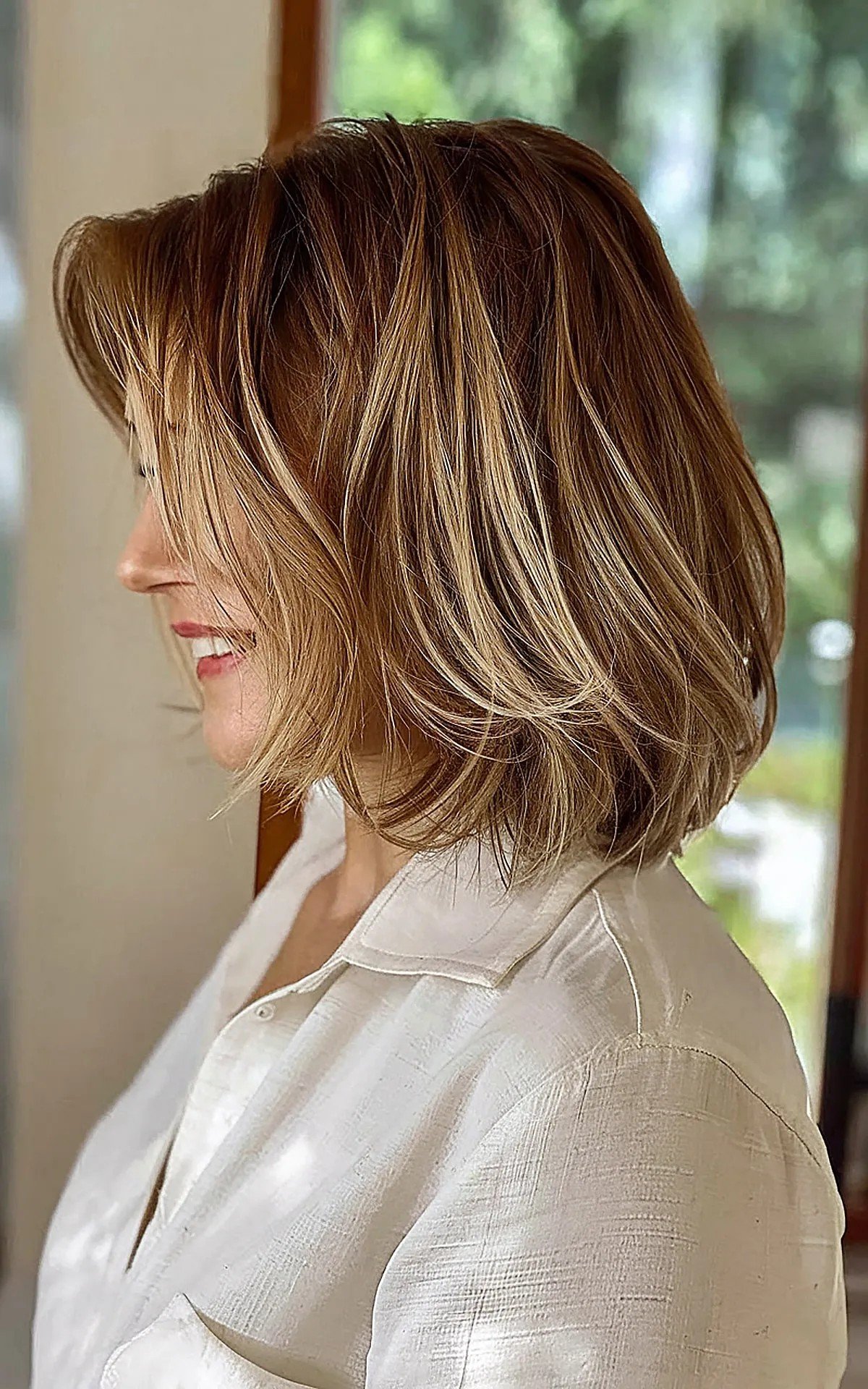 Shoulder-grazing bob with subtle Choppy Layers for Women Over 40
