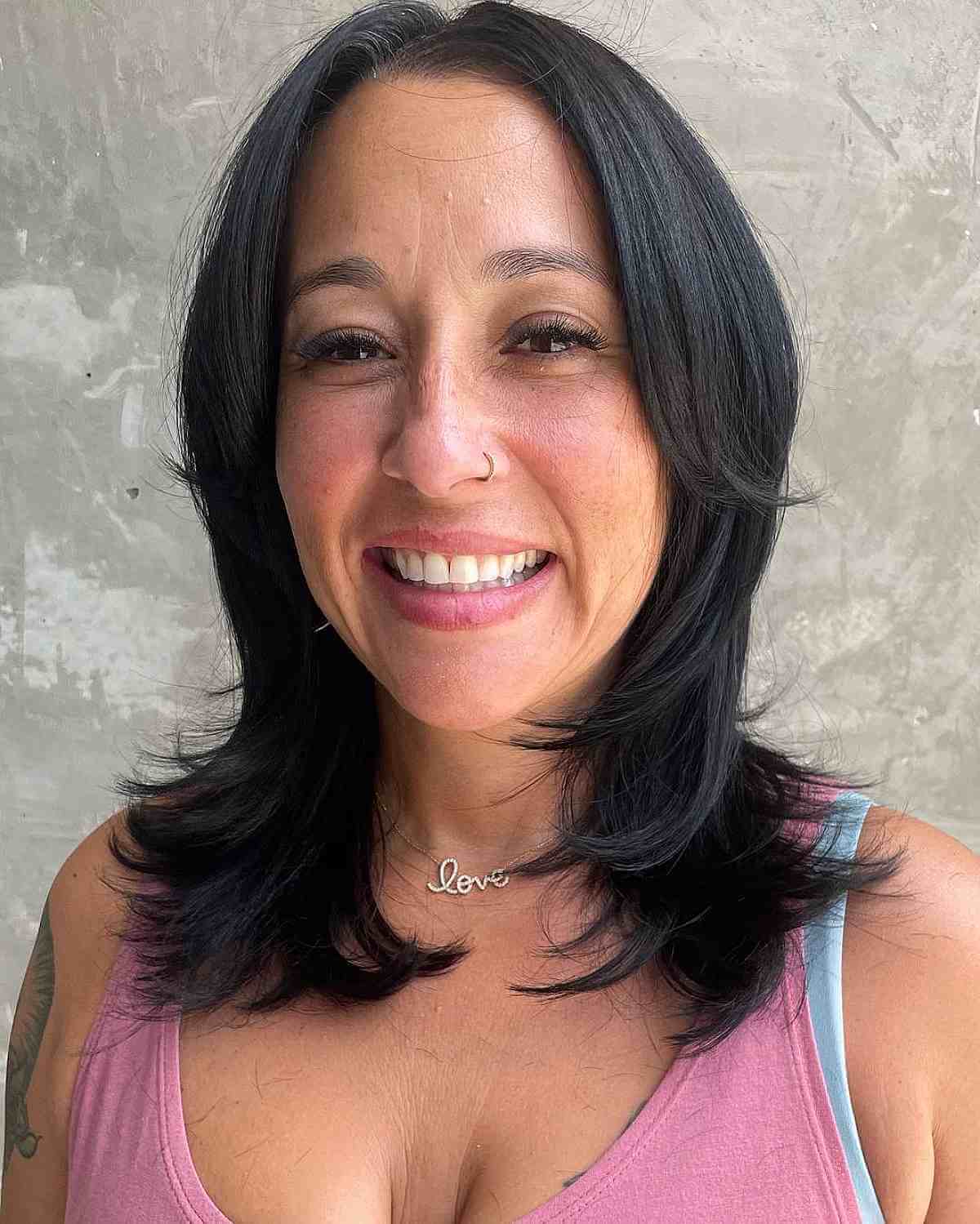 Shoulder-Length Layered Hair with Feathered Ends