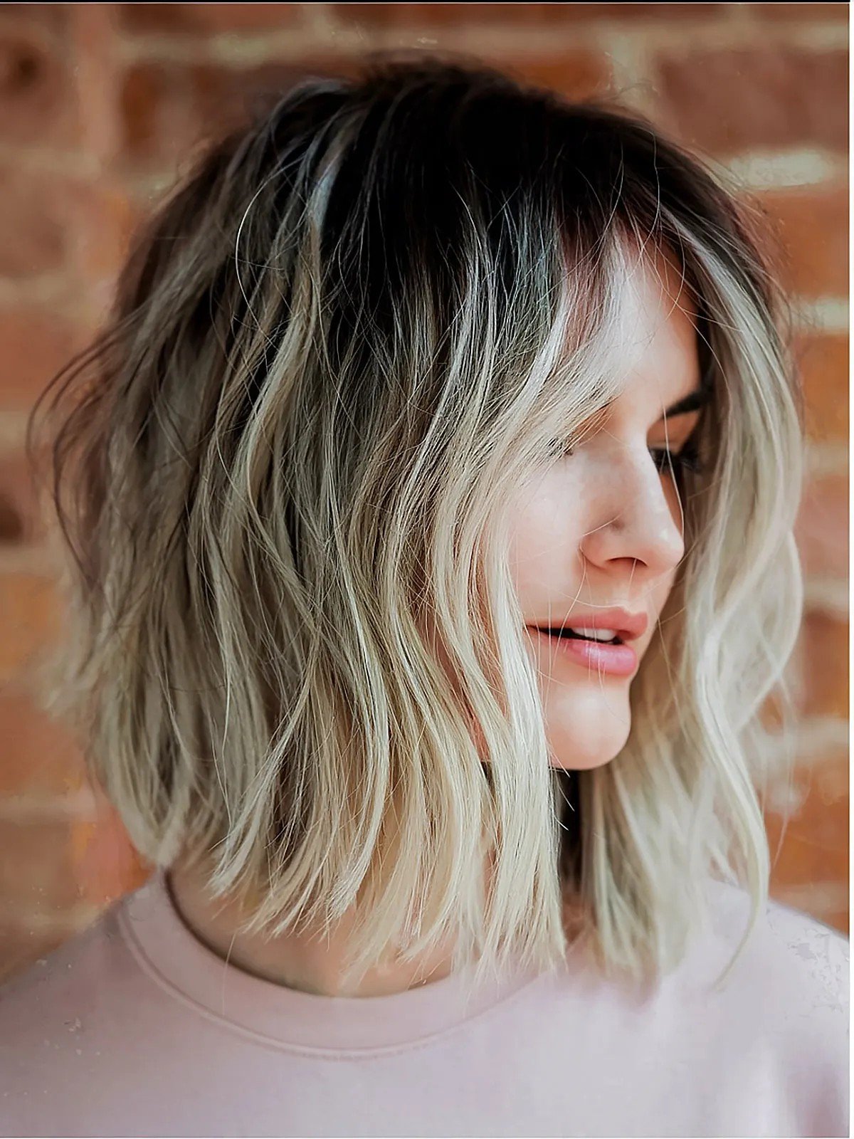 straight cut choppy bob with dark roots