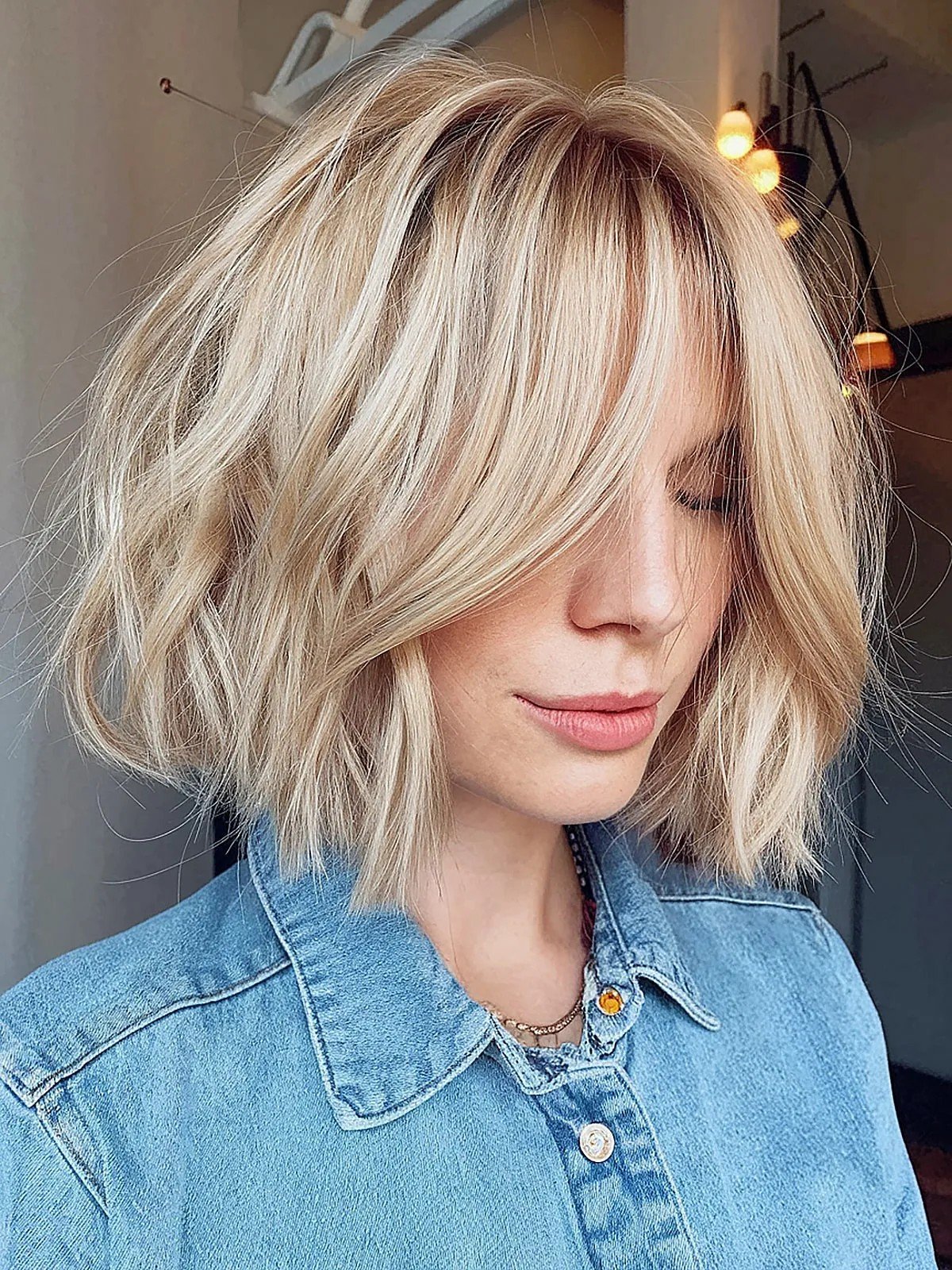 Thick Choppy Bob with Long Curtain Bangs and Angled Layers for Denser Hair Type