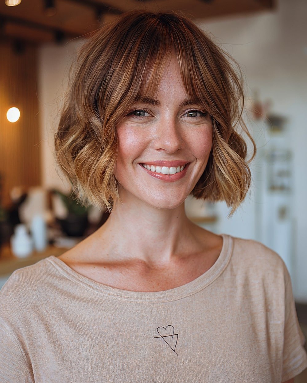 Wavy French bob with curtain bangs for soft face-framing on fine blonde hair